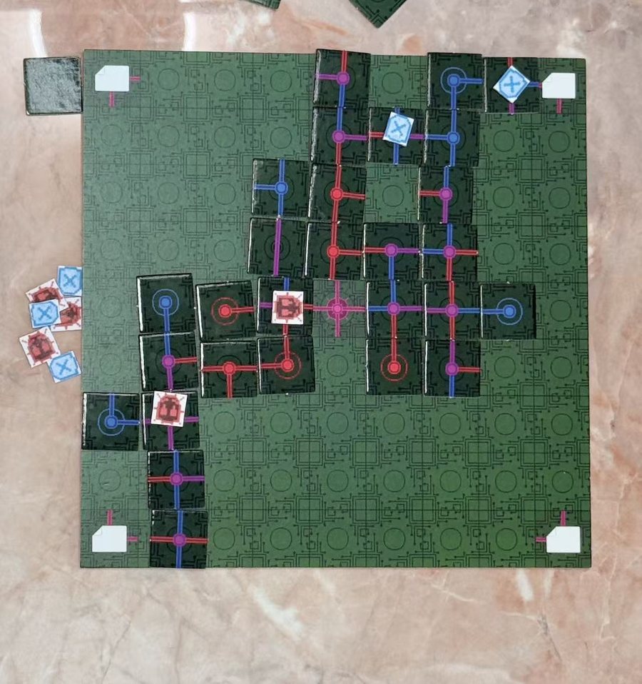 Top-down view of the board mid-game with tiles laid and figures placed
